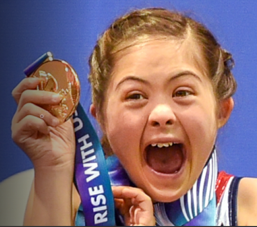Child receiving a Special Olympics award